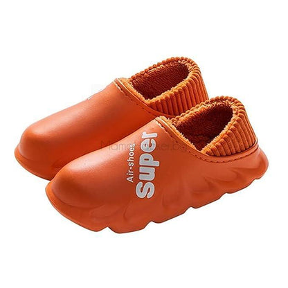 Зимни чехли FrostyFootwear в оранжево, удобни и водонепромокаеми, идеални за ежедневие и топлина у дома | Поръчай от MamaHacker.bg